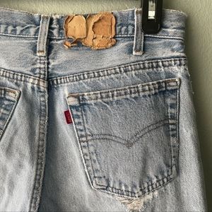 Vintage Levi's 501 light wash distressed jeans